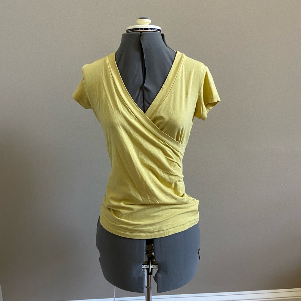 yellow v neck shirt